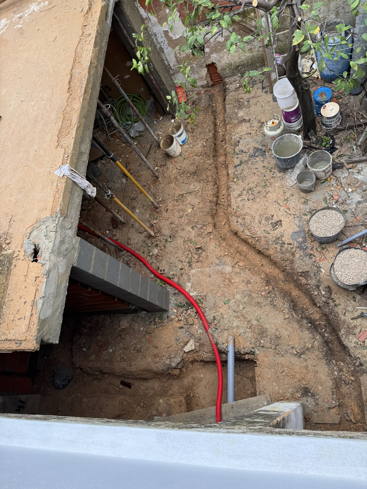 trenches for new plumbing and AC