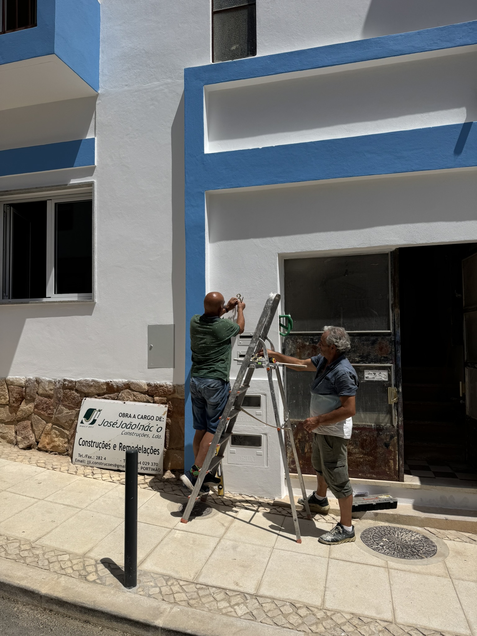 Numbers being measured for the house number plate