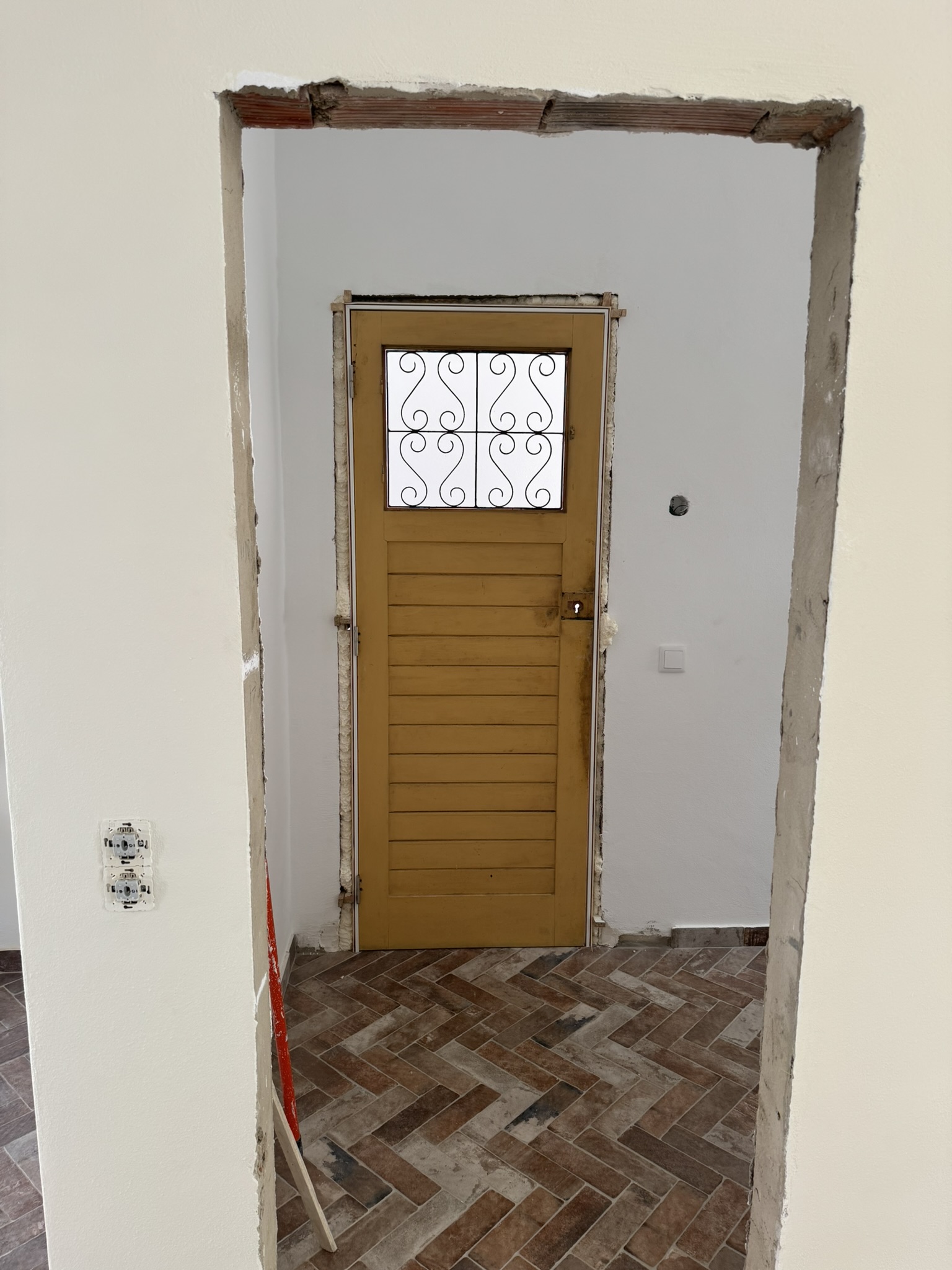 Original apartment frontdoor with new frame